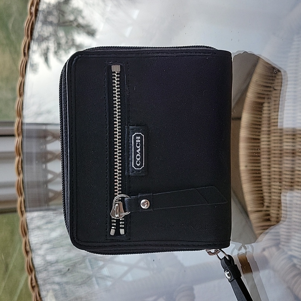 Coach black leather wallet with zipper closure and outside zipper pocket